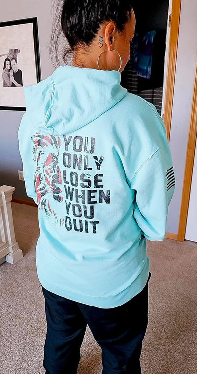 Woman wearing Mint Men's You Only Lose When You Quit Back Design Hoodie