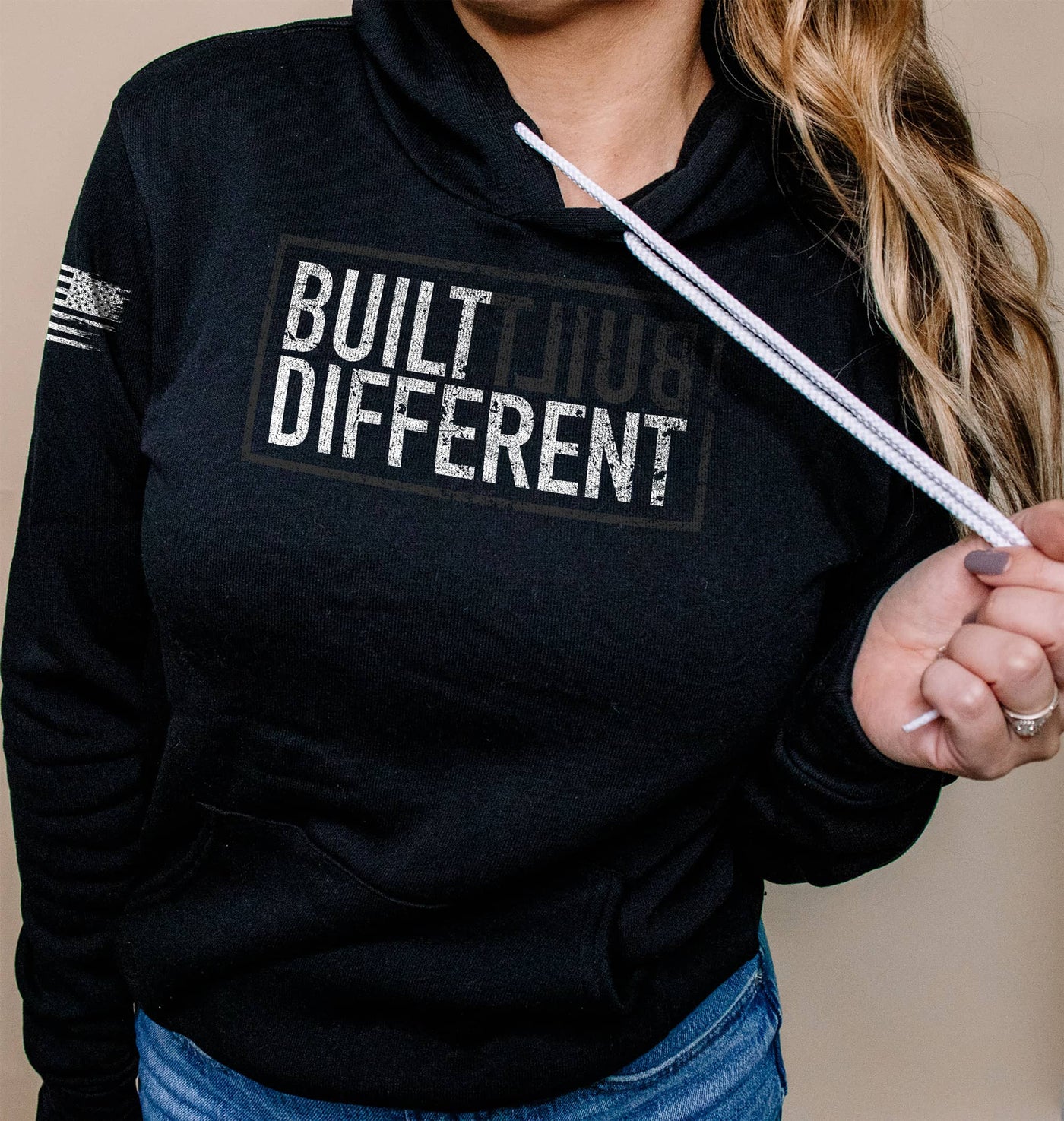 Woman wearing Built Different Women's front design solid black hoodie