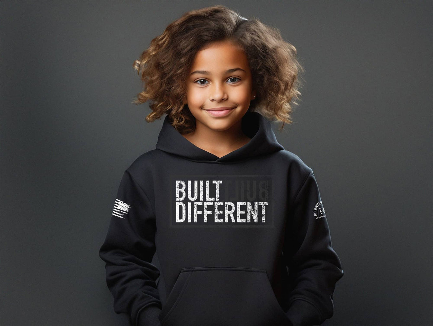Girl wearing Built Different Youth front design solid black hoodie