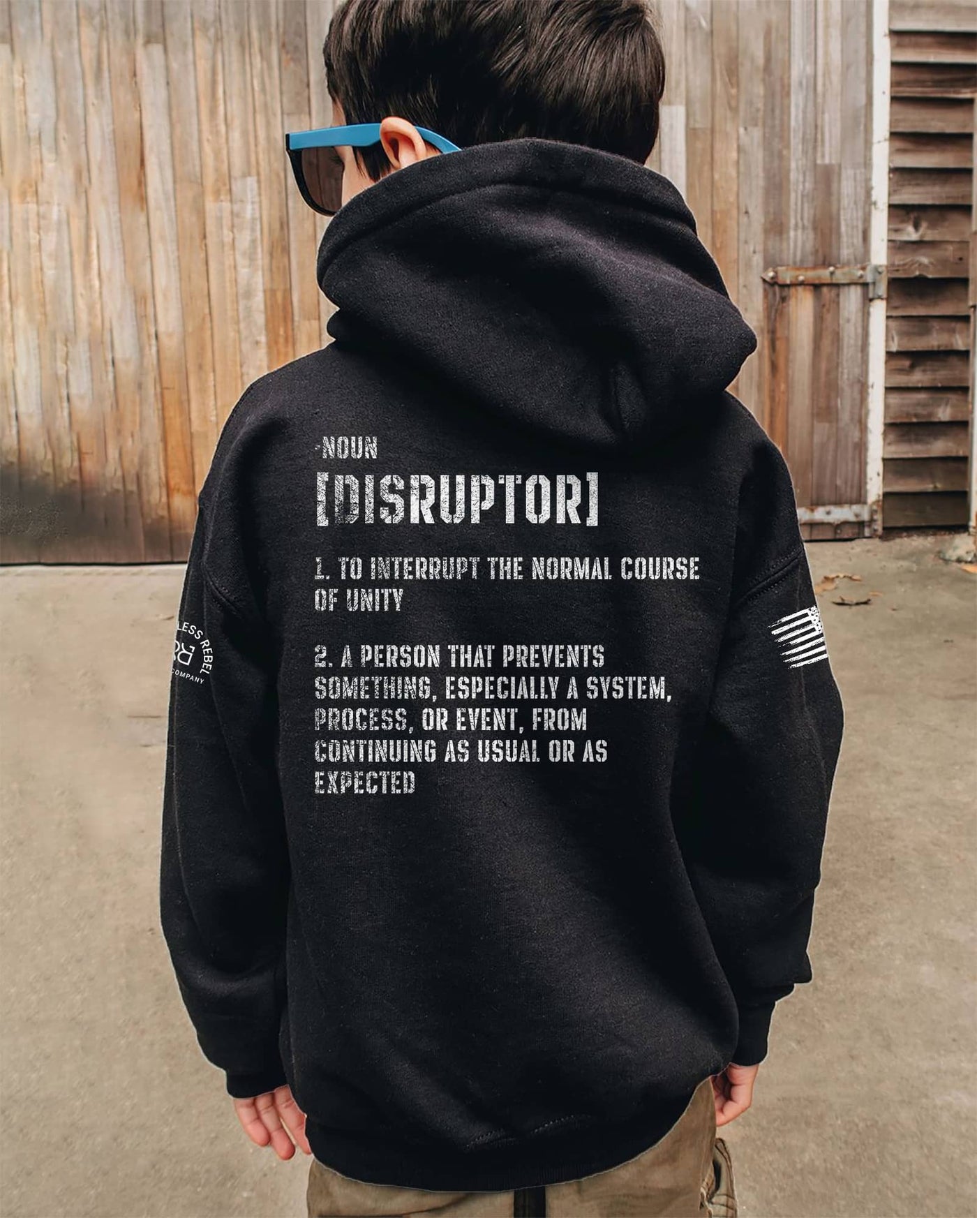 Boy wearing Solid Black The Disruptor Back Design Youth Hoodie