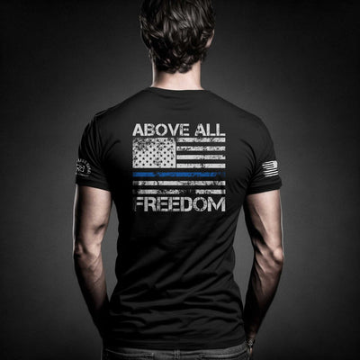 Man wearing Solid Black Men's Above All Freedom Back Design Tee