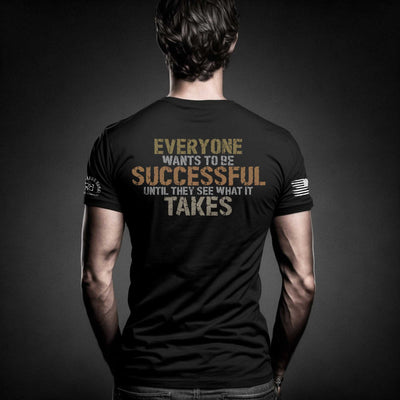 Man wearing Solid Black Men's Everyone Wants to Be Successful Back Design Tee