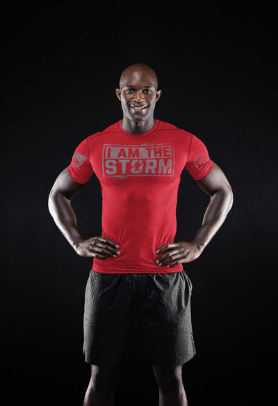 Man wearing Solid Red I Am The Storm Front Design Men's Tee