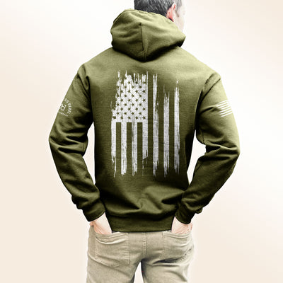 Man wearing Military Green Men's Rebel Patriot Flag Back Design Hoodie