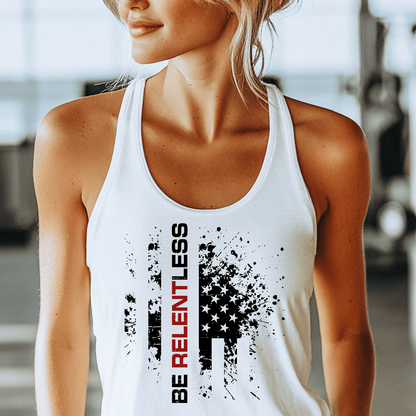 Woman wearing a white tank top with a graphic design and text.