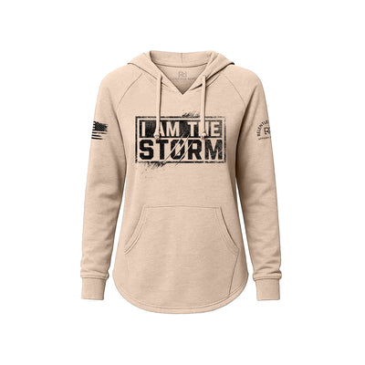 Blush hoodie with 'I am the Storm' text on a white background