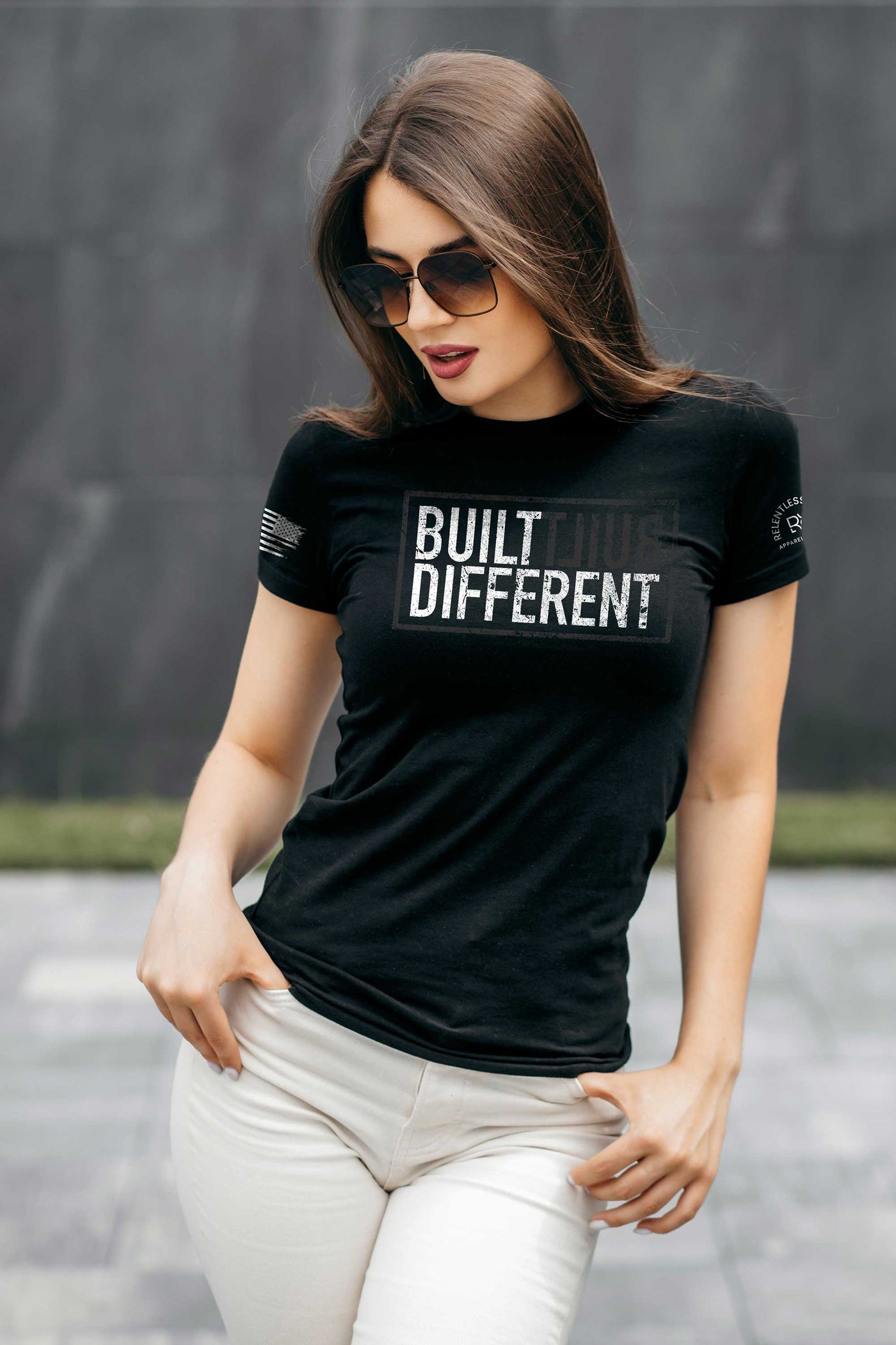 Woman wearing Built Different Women's Solid Black front design t-shirt