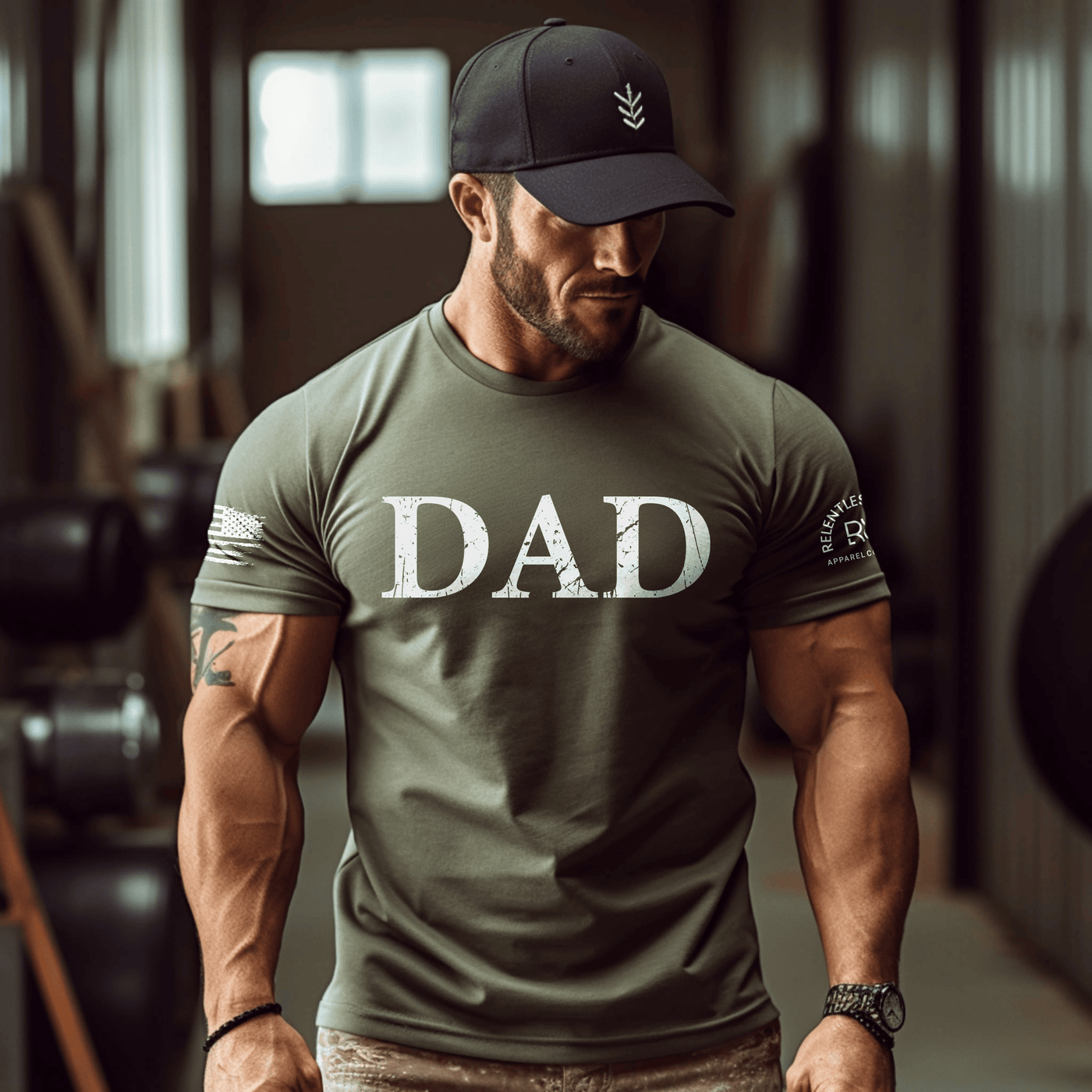 Man wearing a green 'DAD' t-shirt in a gym setting