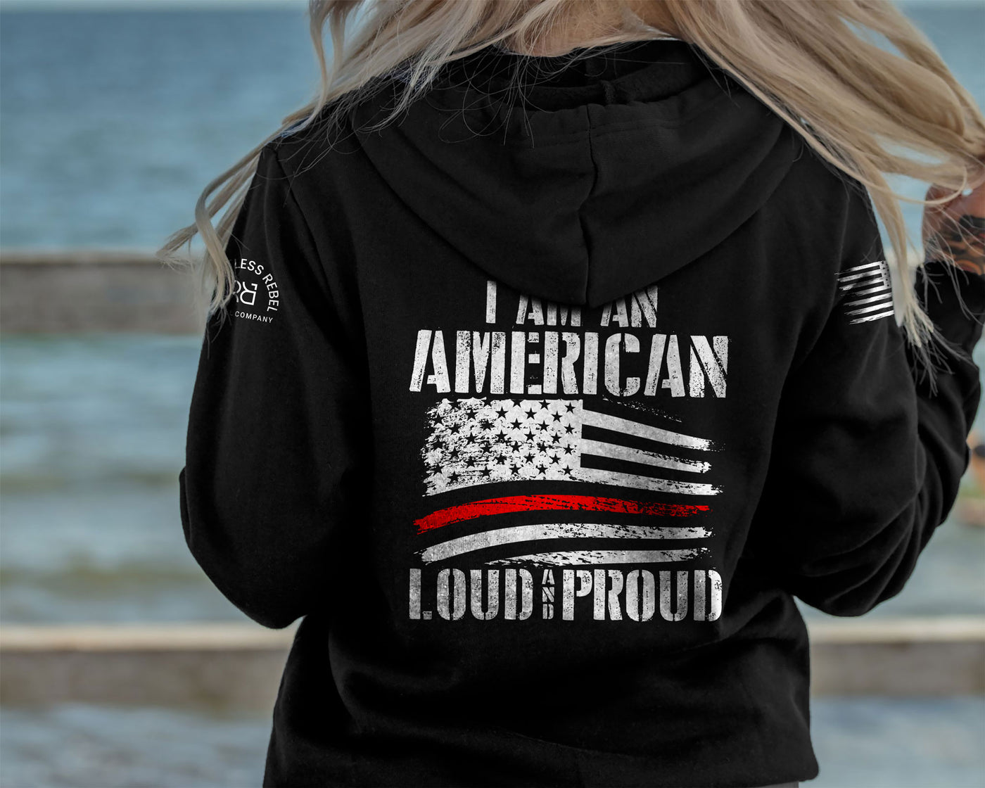Woman wearing Solid Black Women's I Am An American Loud and Proud Back Design Hoodie