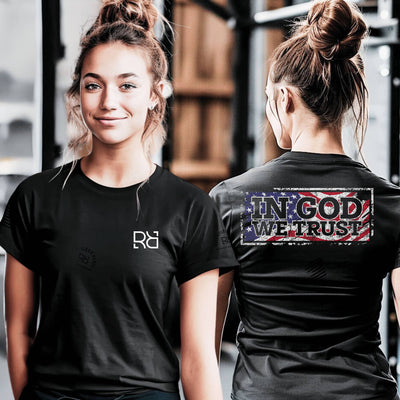 Two people wearing black t-shirts, one with a logo on the front and the other with 'IN GOD WE TRUST' on the back.