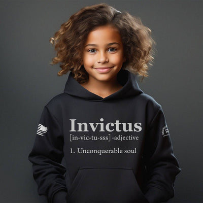 Child wearing a black hoodie with 'Invictus' text on a dark background