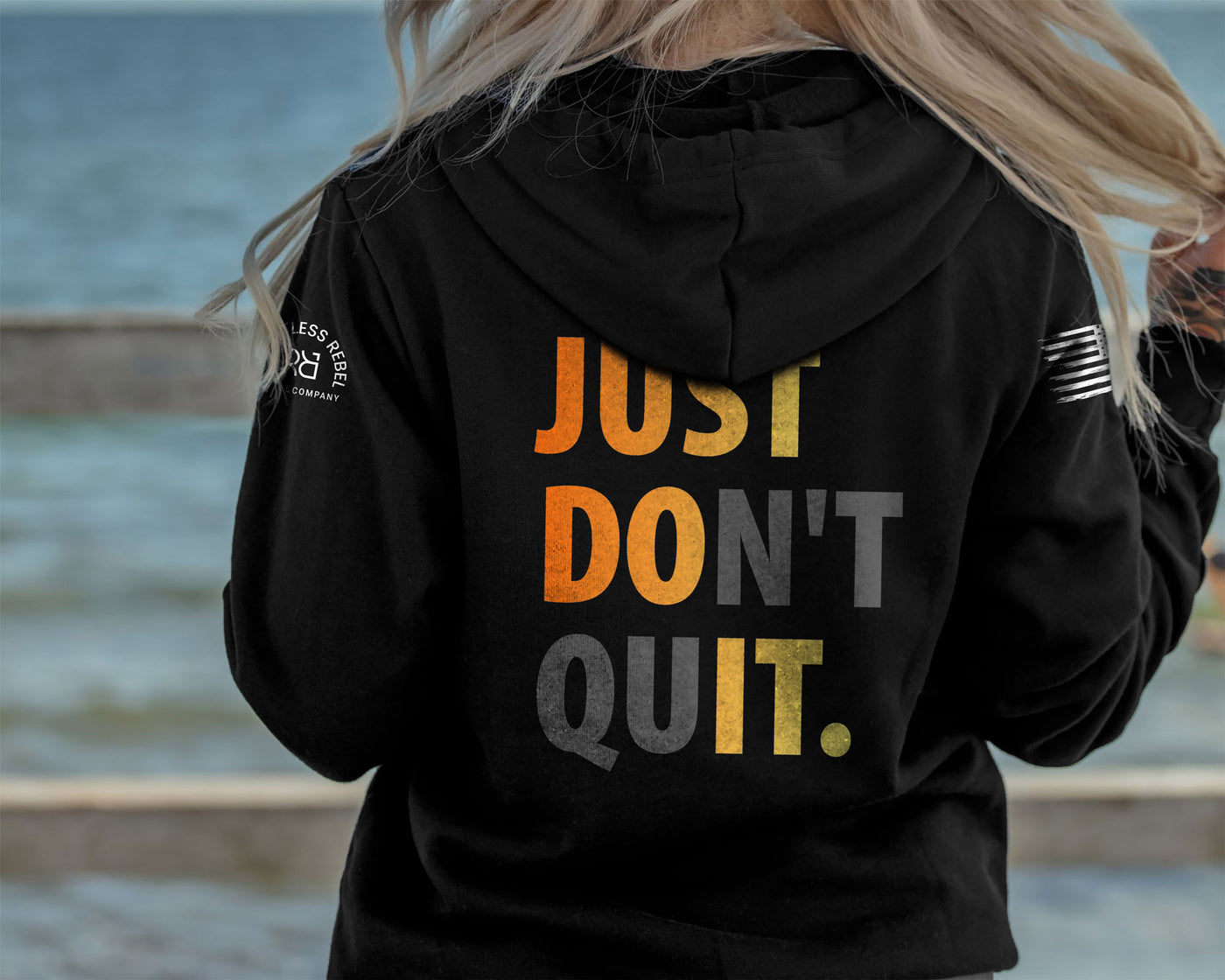 Woman wearing Solid Black Women's Just Don't Quit Back Design Hoodie