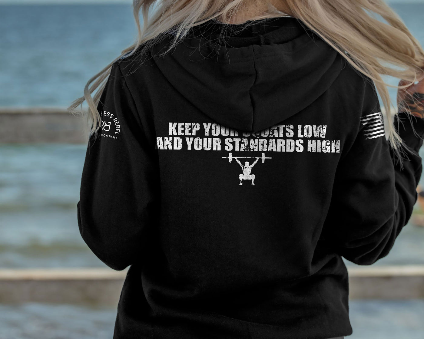 Woman wearing Solid Black Women's Keep Your Squats Low and Your Standards High Back Design Hoodie