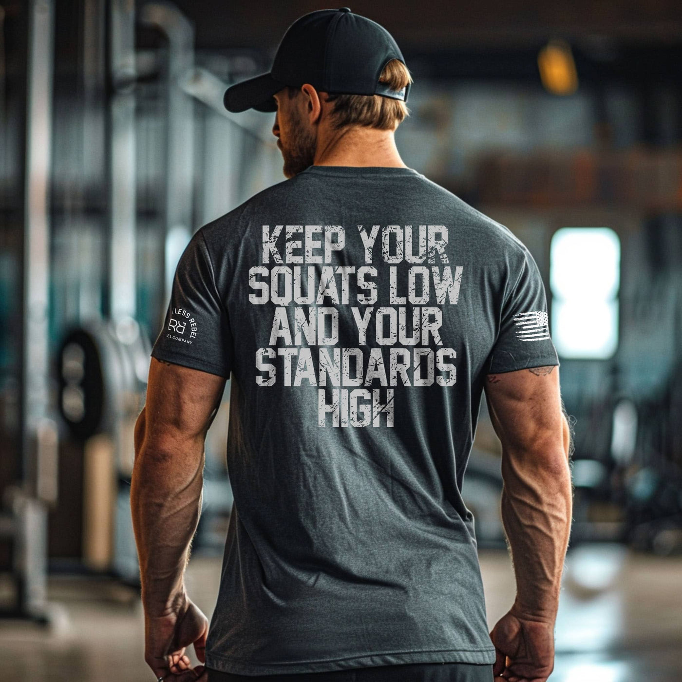 Man wearing a t-shirt with motivational text in a gym setting