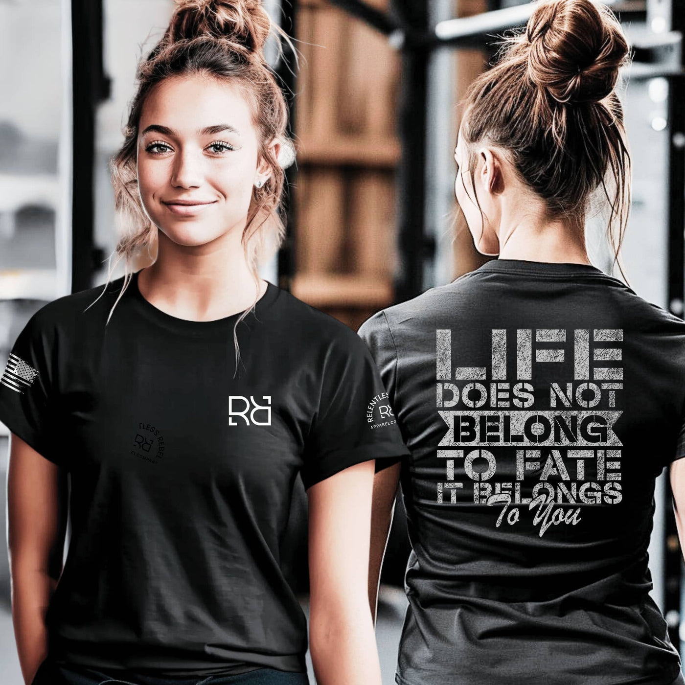 Two people wearing black t-shirts with visible branding and motivational quote.
