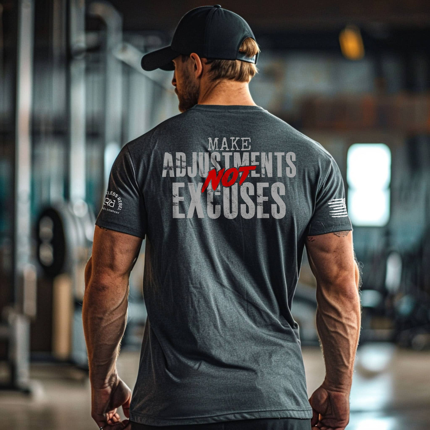 Man wearing a t-shirt with motivational text in a gym setting