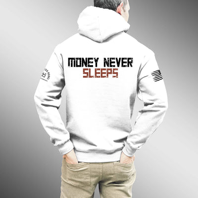 Person wearing a white hoodie with 'Money Never Sleeps' text on the back against a gray background