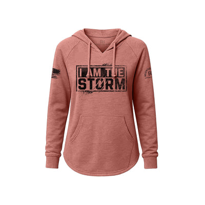 Pink hoodie with 'I AM THE STORM' text on a white background
