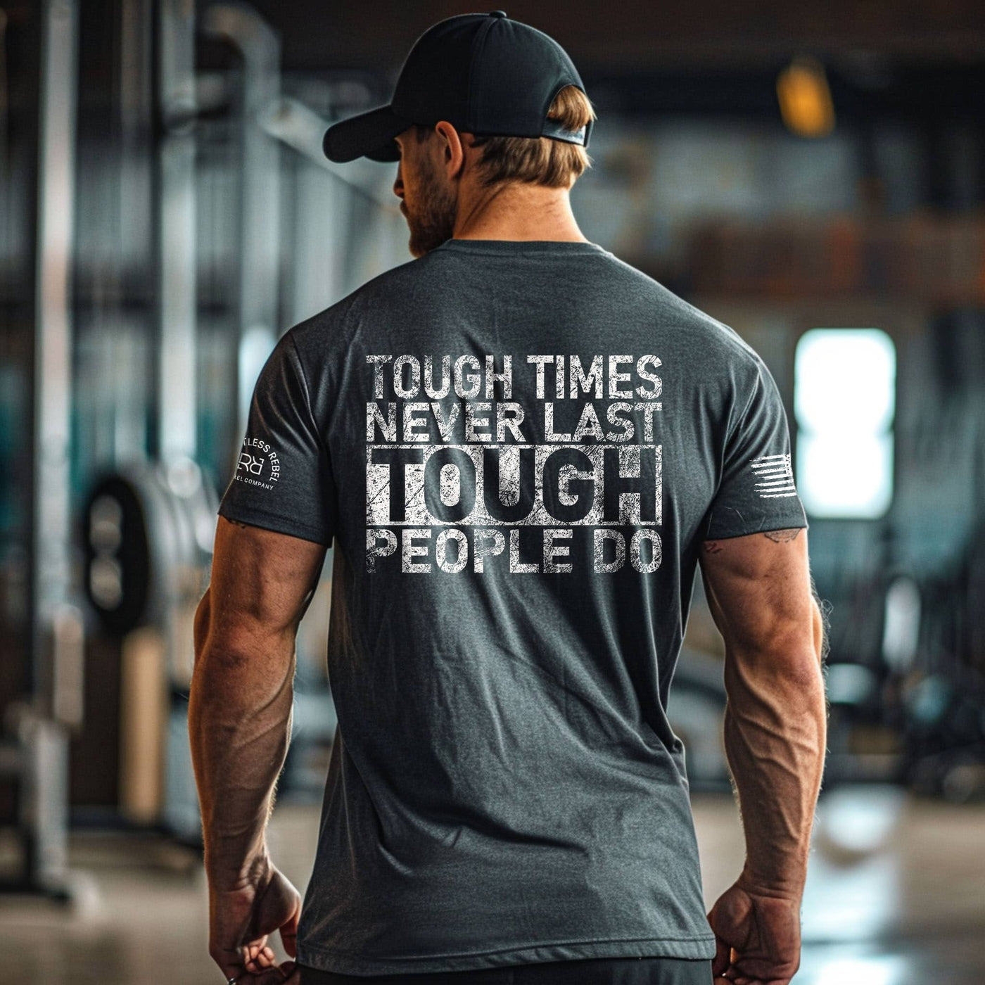Man wearing a motivational t-shirt with text in a gym setting