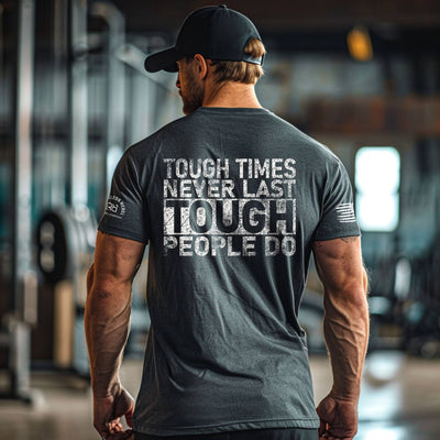 Man wearing a motivational t-shirt with text in a gym setting