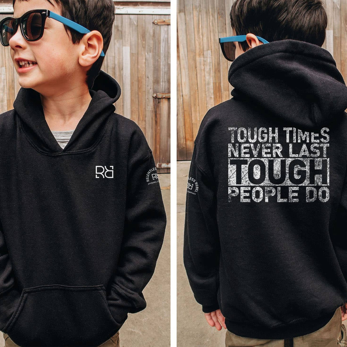 Child wearing a black hoodie with a motivational quote on the back, standing in front of a wooden fence.
