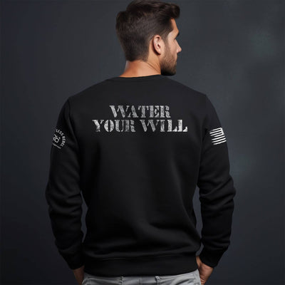 Man wearing a black crew neck sweatshirt with Water Your Will on the back