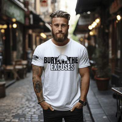 Man wearing a white t-shirt with 'Bury The Excuses' text on a street.