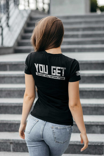 Woman wearing Solid Black Women's You Get What You Work For Back Design Tee