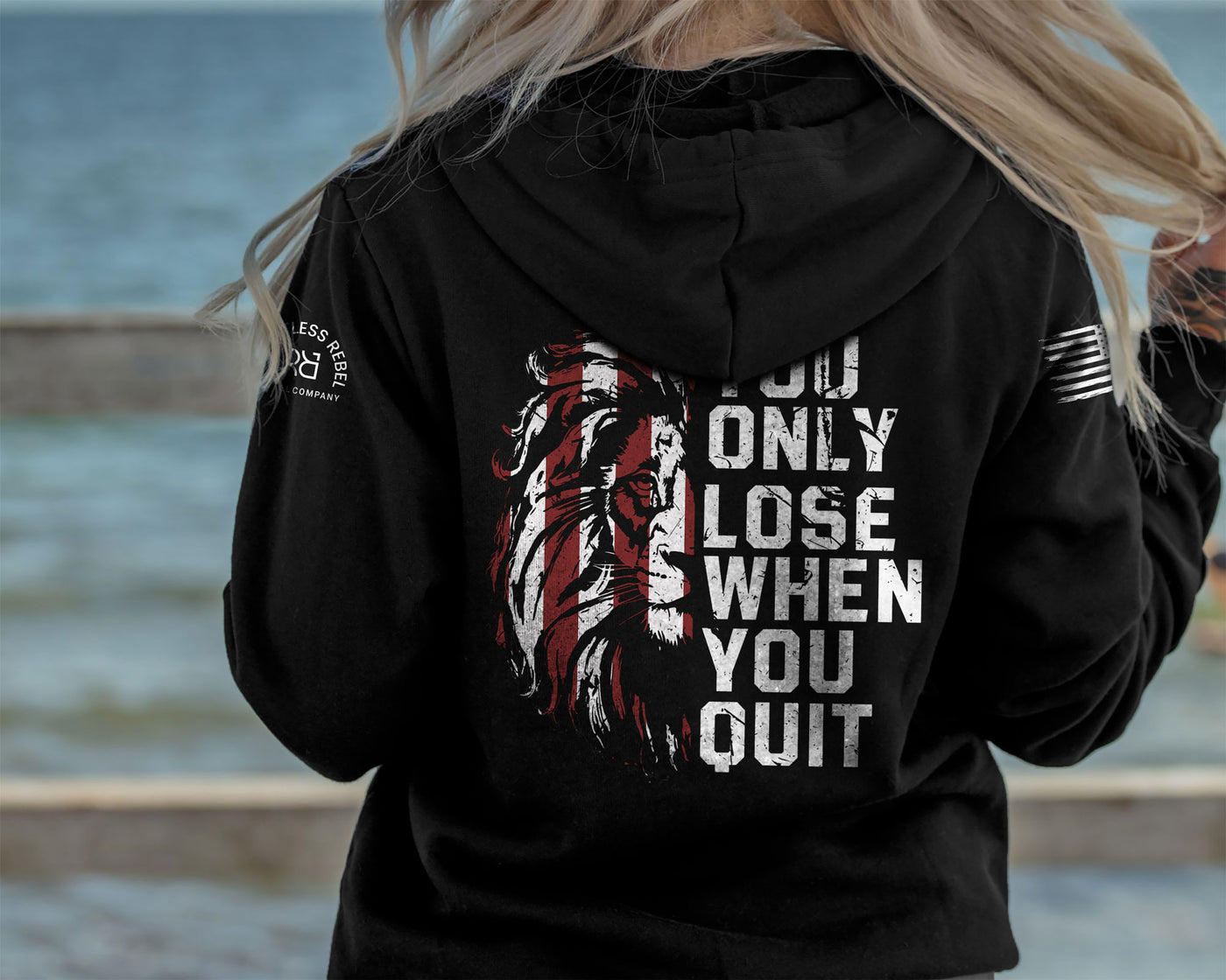 Woman wearing Solid Black Women's You Only Lose When You Quit Back Design Hoodie