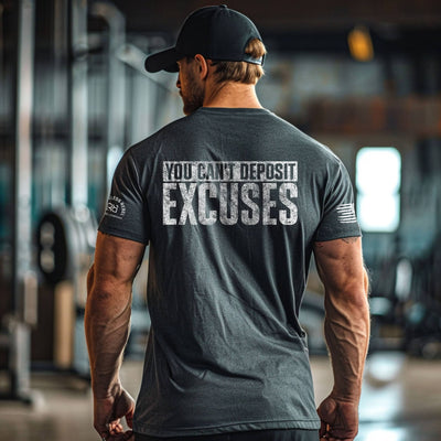 Man wearing a t-shirt with motivational text in a gym setting