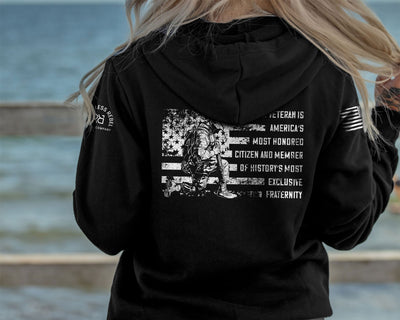 Woman wearing Solid Black Women's A Veteran Back Design Hoodie