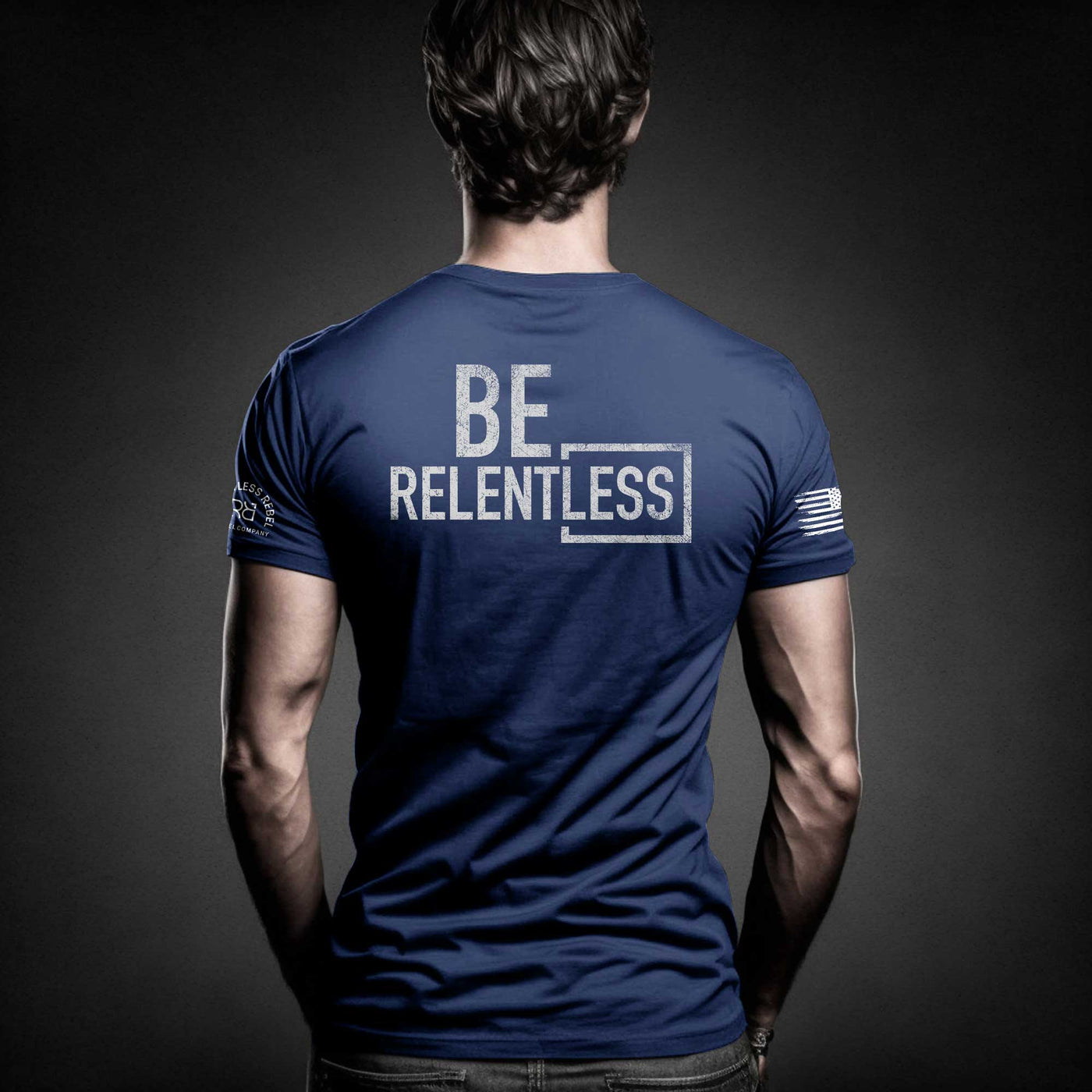 Man wearing Rebel Blue Men's Be Relentless Back Design Tee