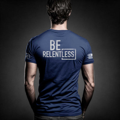 Man wearing Rebel Blue Men's Be Relentless Back Design Tee
