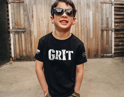 Boy wearing Solid Black Youth Grit Front Design Tee