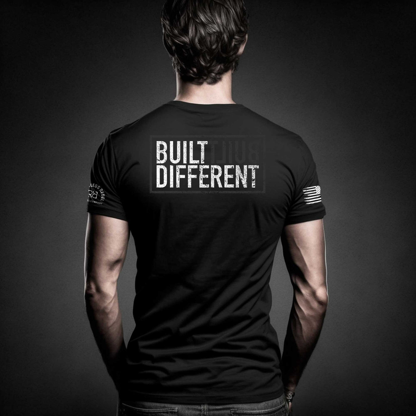 Man wearing Solid Black Built Different tee.