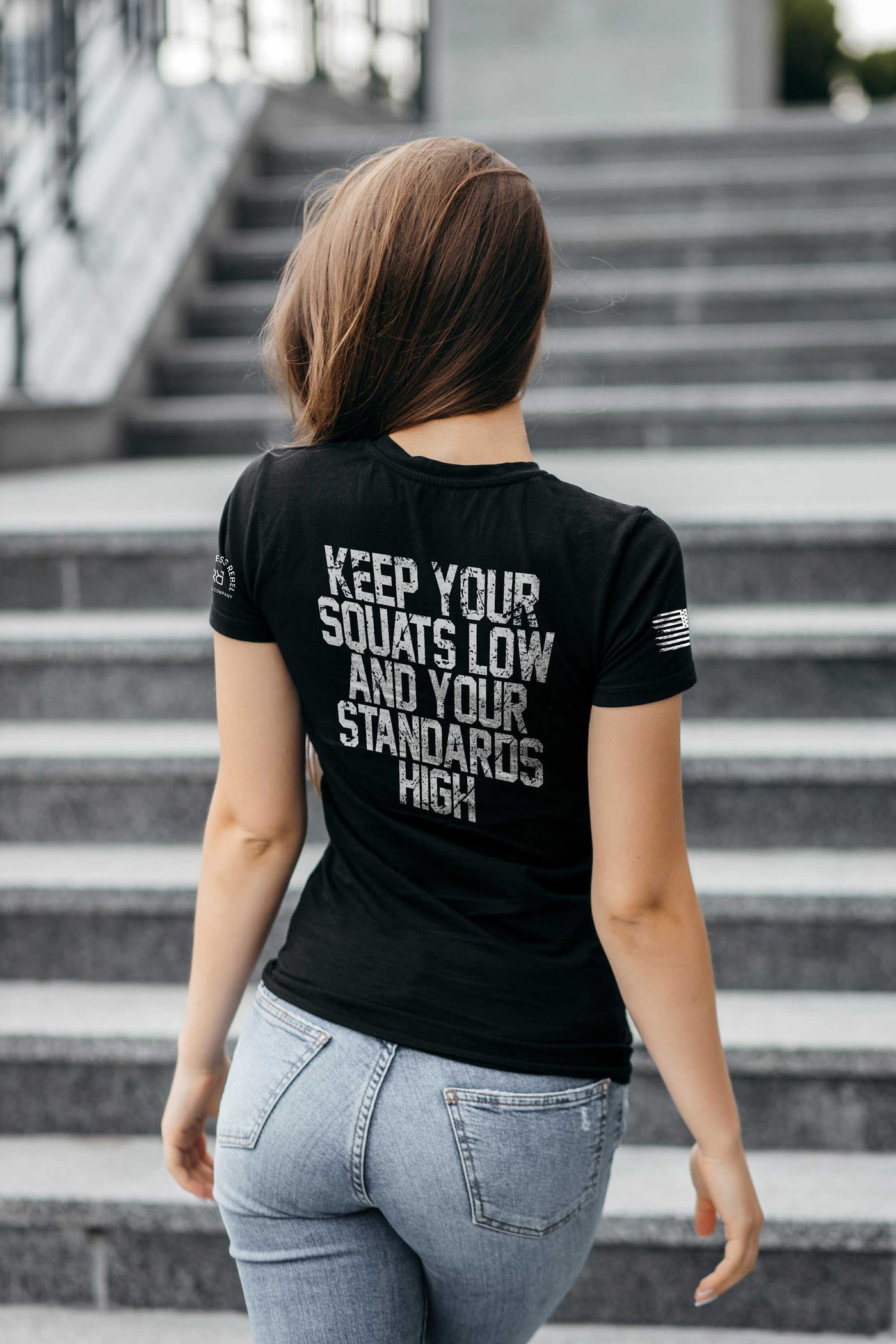 Woman wearing Solid Black Women's Keep Your Squats Low and Your Standards High Back Design Tee