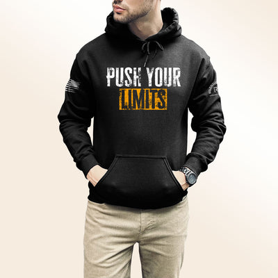 Man wearing Solid Black Men's Push Your Limits Front Design Hoodie