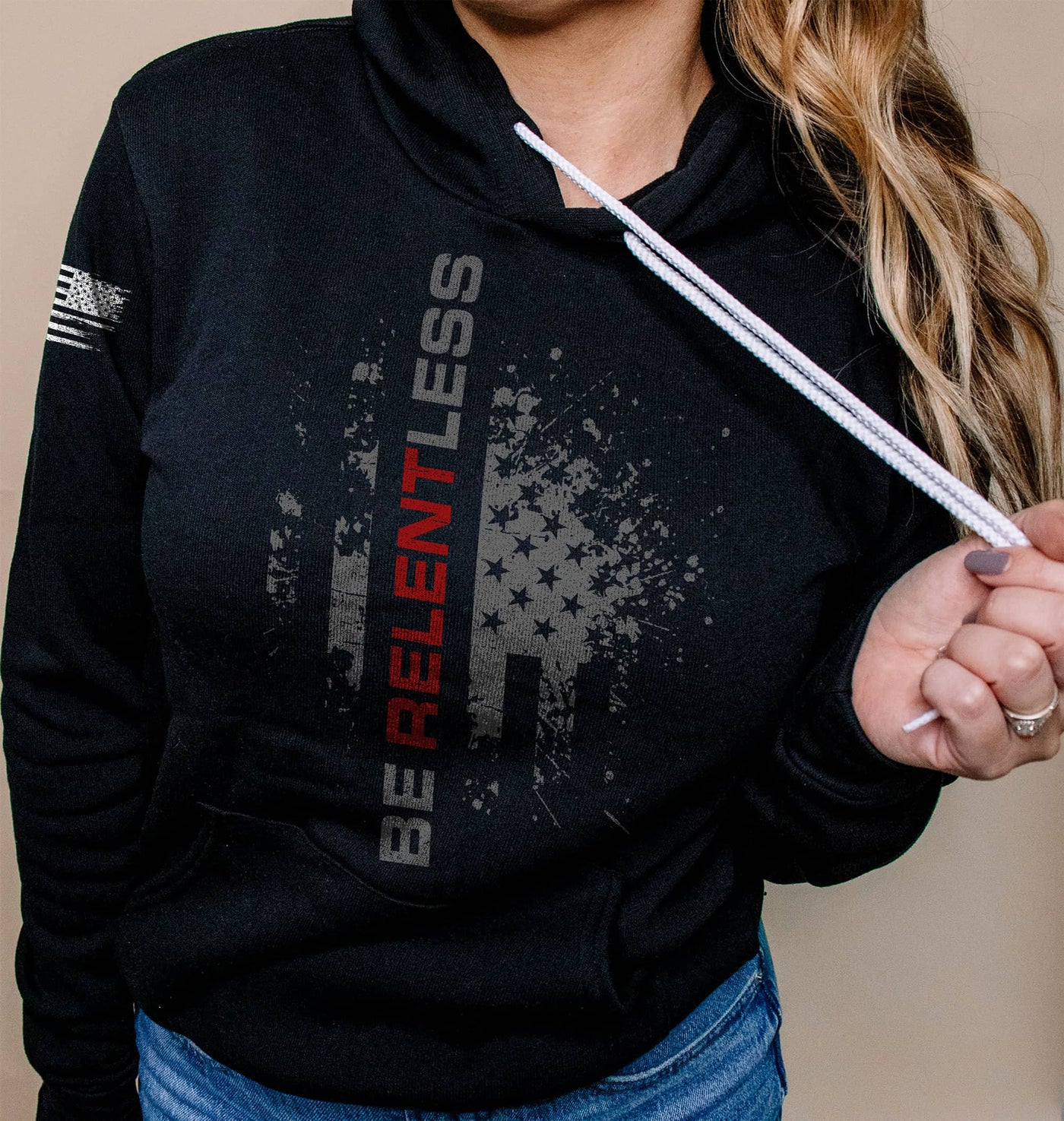 Woman wearing Solid Black Women's Be Relentless Front Design Hoodie