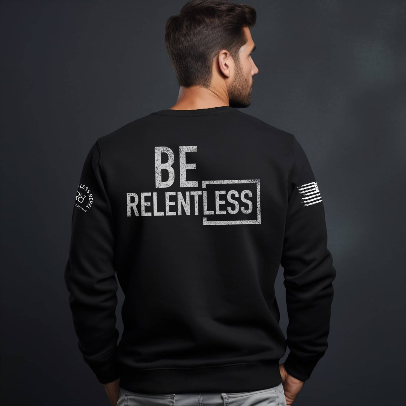 Man wearing Solid Black Men's Be Relentless Back Design Sweatshirt