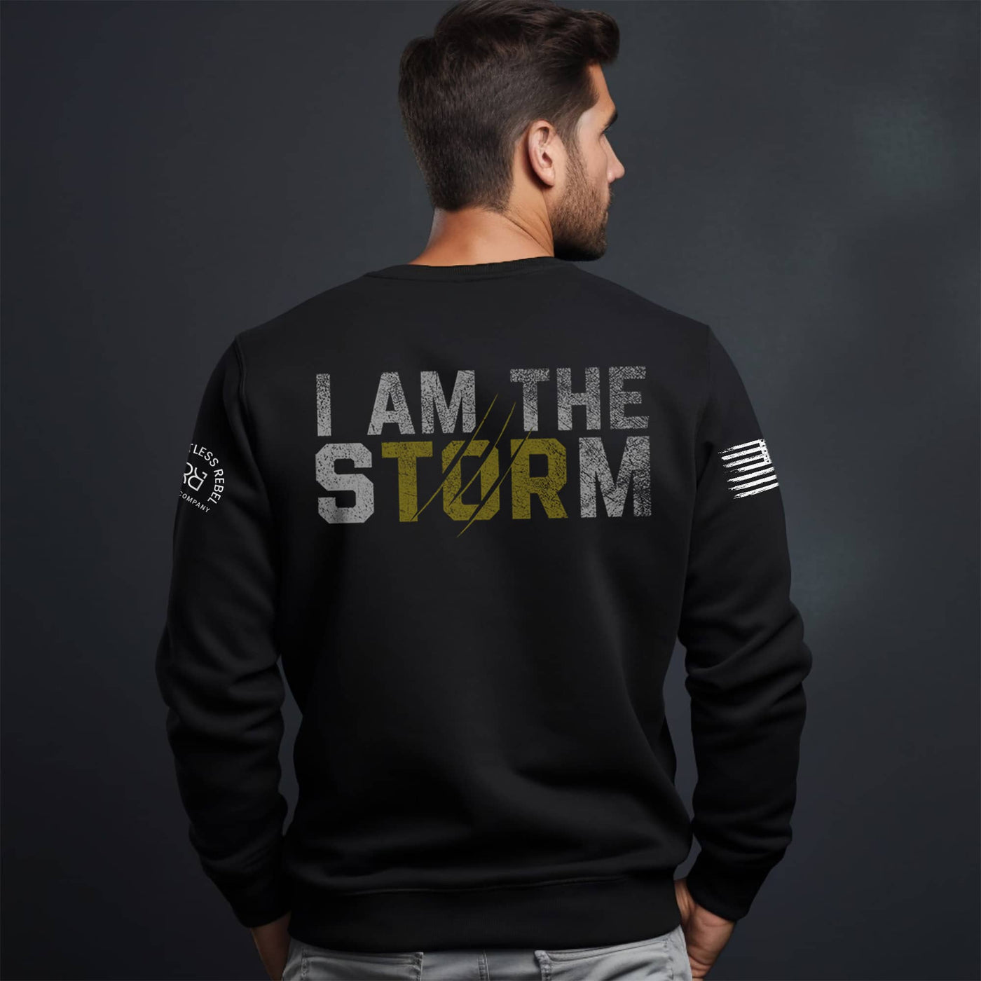 Man wearing Solid Black Men's I Am The Storm Back Design Crew Neck Sweatshirt