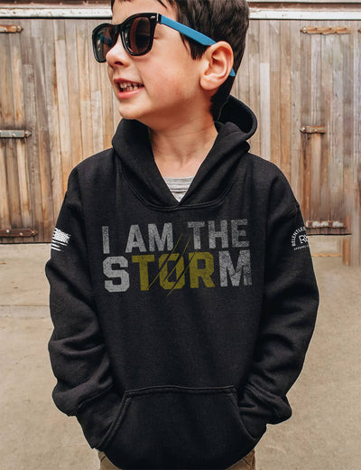 Boy wearing Solid Black Youth I Am The Storm Front Design Hoodie