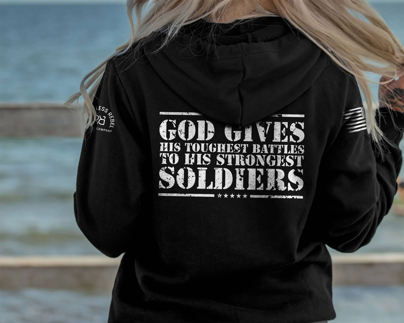 Woman wearing Solid Black Women's God Gives His Toughest Battles Back Design Hoodie