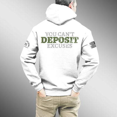 Person wearing a white hoodie with motivational text on the back against a gray background