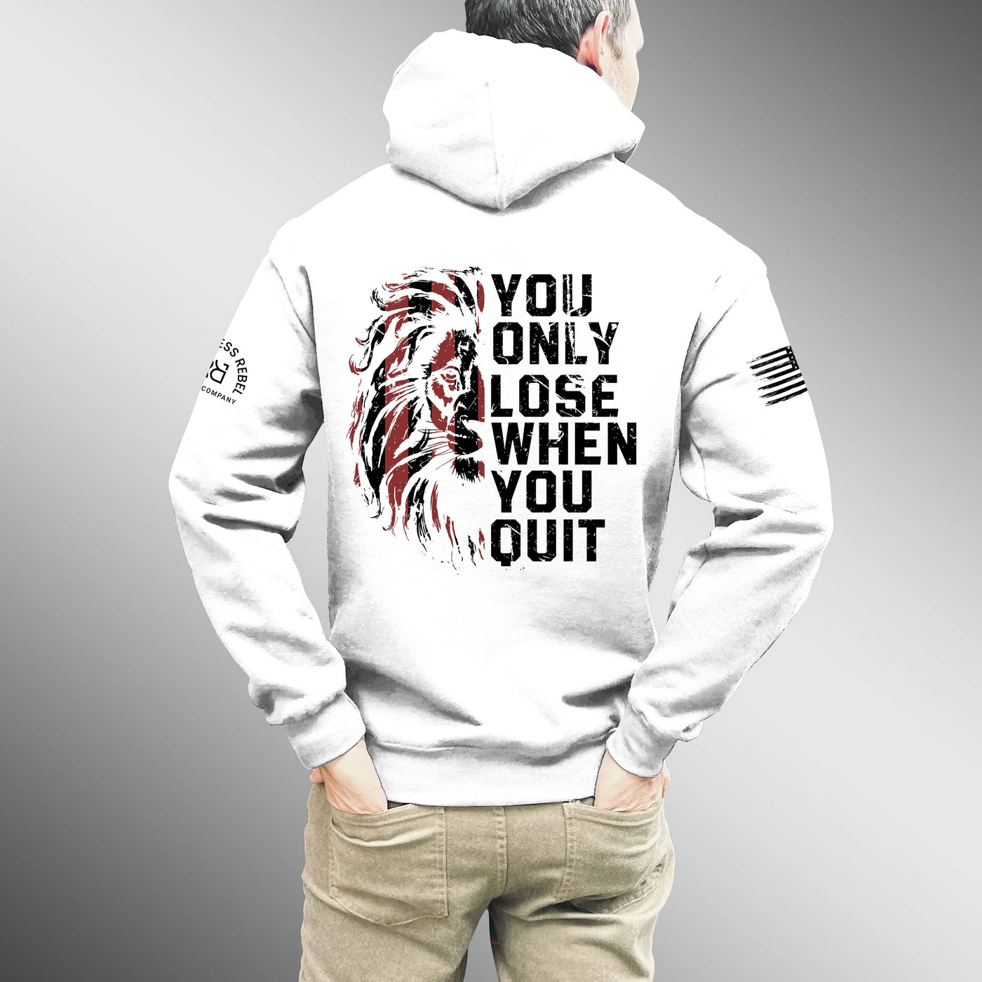 Person wearing a white hoodie with motivational text and graphics on the back, on a gray background.