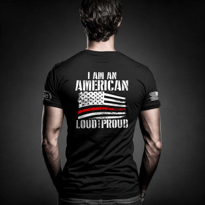 Man wearing Solid Black Men's I Am An American Loud and Proud Back Design Tee