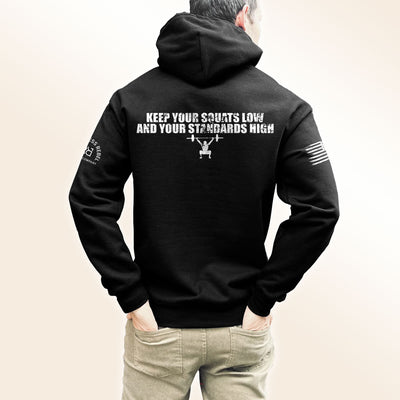 Man wearing Solid Black Men's Keep Your Squats Low and Your Standards High Back Design Hoodie