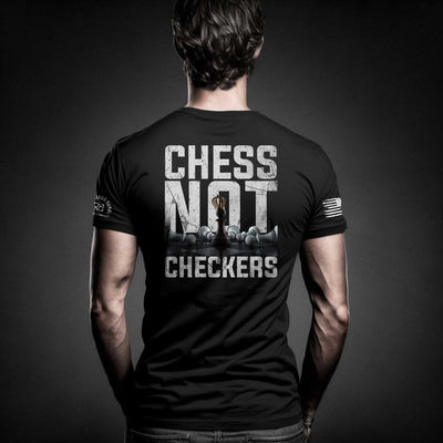 Man wearing Solid Black Men's Chess Not Checkers Back Design Tee