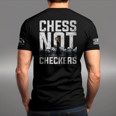Man wearing Solid Black Men's Chess Not Checkers Back Design Tee