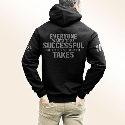 Man wearing Solid Black Men's Everyone Wants to Be Successful Back Design Hoodie