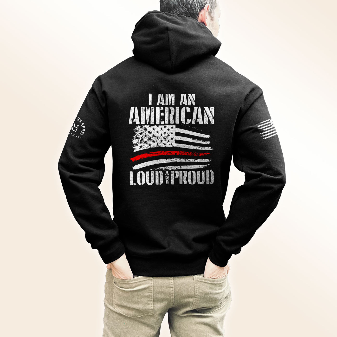 Man wearing Solid Black Men's I Am An American Loud and Proud Back Design Hoodie